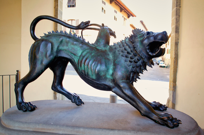 A bronze statue of a mythical chimera.