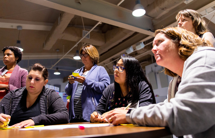 Educators participating in a reflection activity for The Tech Academies Fellowship program.