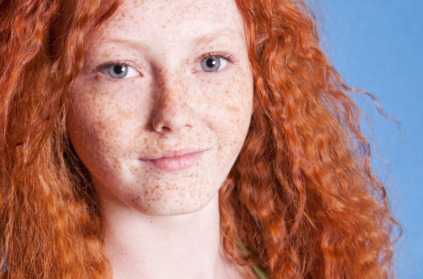 Woman with red hair and freckles