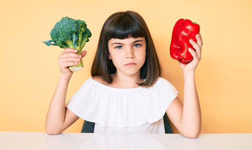 Girl with vegetables.