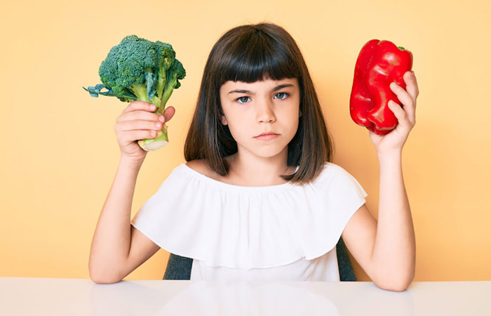 Girl with vegetables.