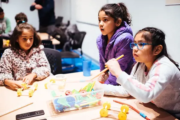 Students participate in an innovation lab at The Tech Interactive during a field trip.