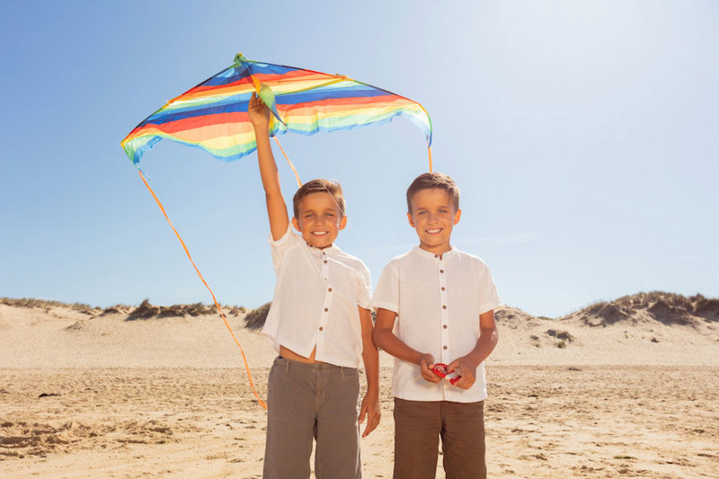 Twin brothers on a beach.