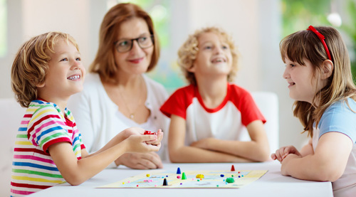 Family playing a board game.