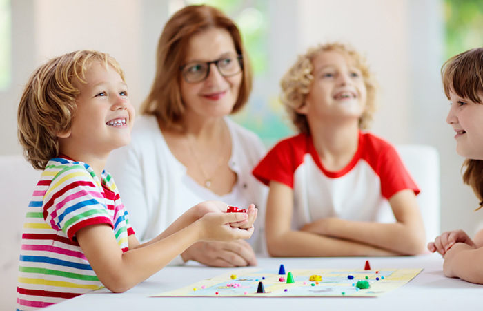Family playing a board game.