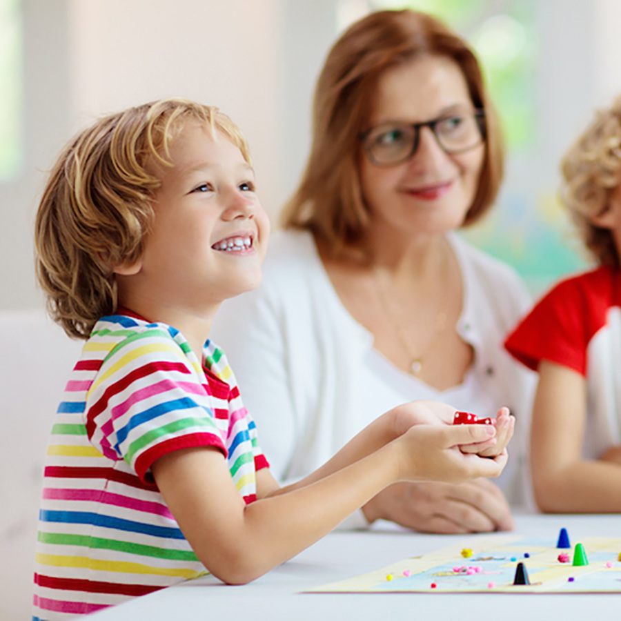 Family playing a board game.