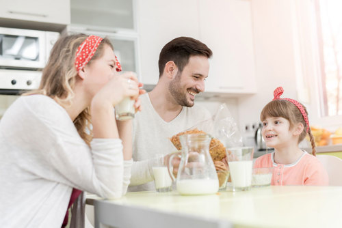 A family with European ancestry drinking milk.