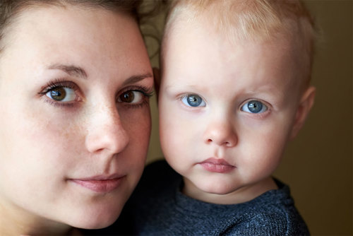 Brown-eyed mother with blue-eyed baby.