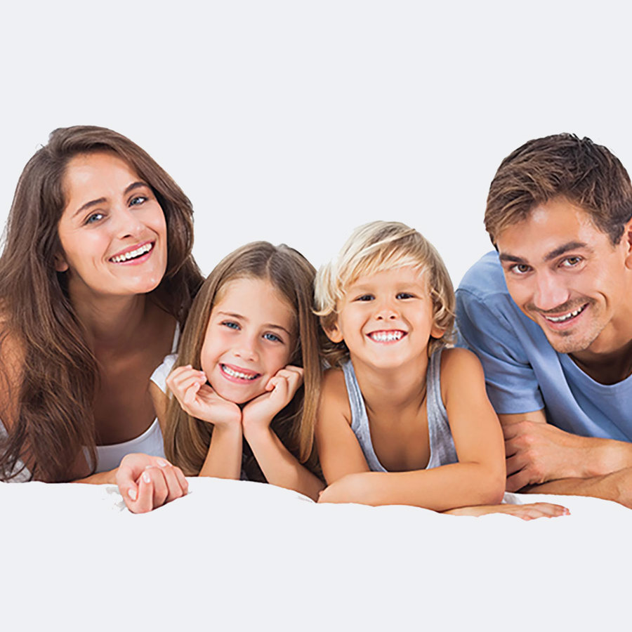 A happy family lying down together.