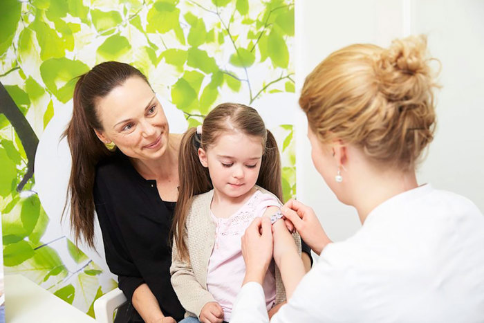 Child getting vaccine.