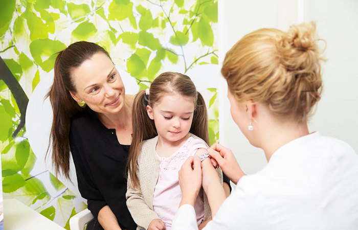 Child getting vaccine.