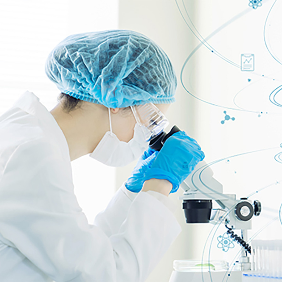 Scientist observing DNA through a microscope.