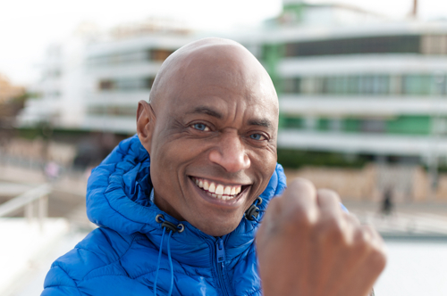 African American man with blue eyes.