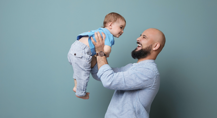 Bald man with child.