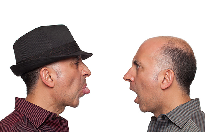 Identical twins fighting.