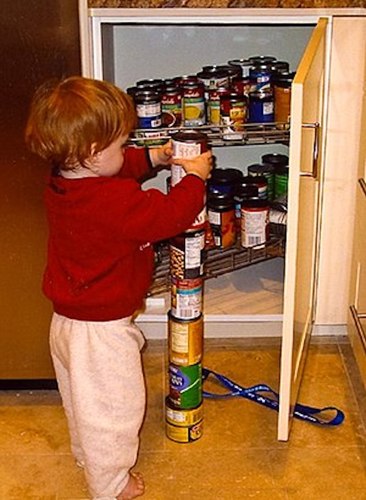 Child with autism stacking cans