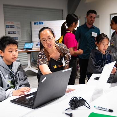 A Software Engineering Education Leader introducing a software engineering activity to students.