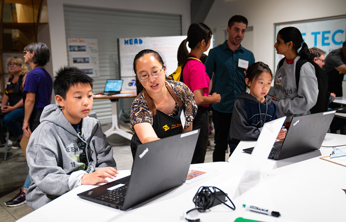 A Software Engineering Education Leader introducing a software engineering activity to students.