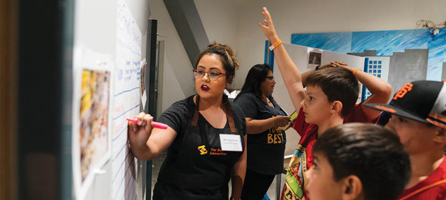 An educator introducing students to an software engineering activity.