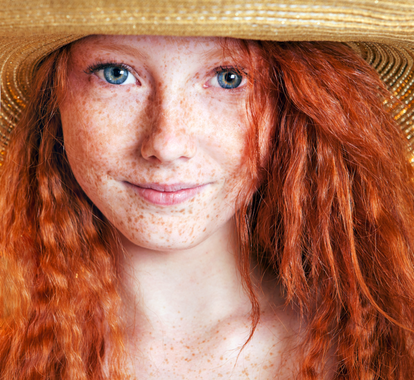 Red-haired girl with freckles.
