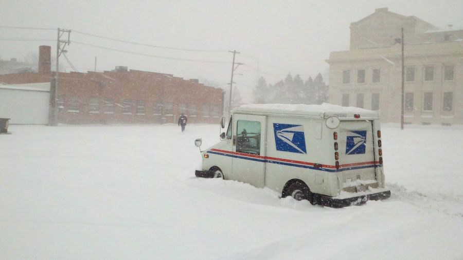 Mail truck in snow.