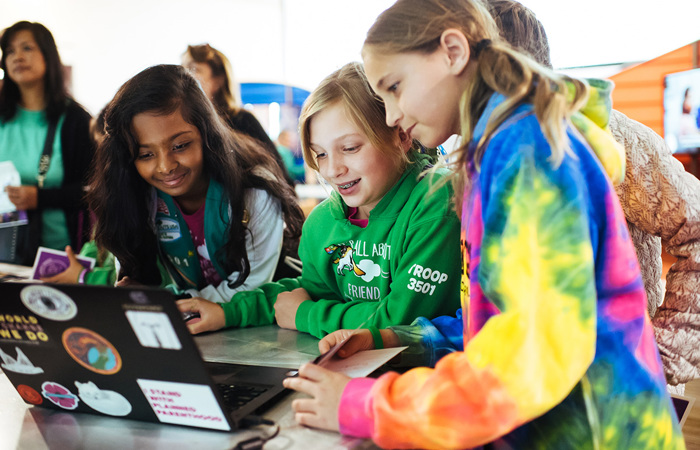 Girl Scout Juniors learning through a laptop.