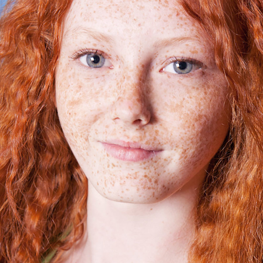 Woman with red hair and freckles.