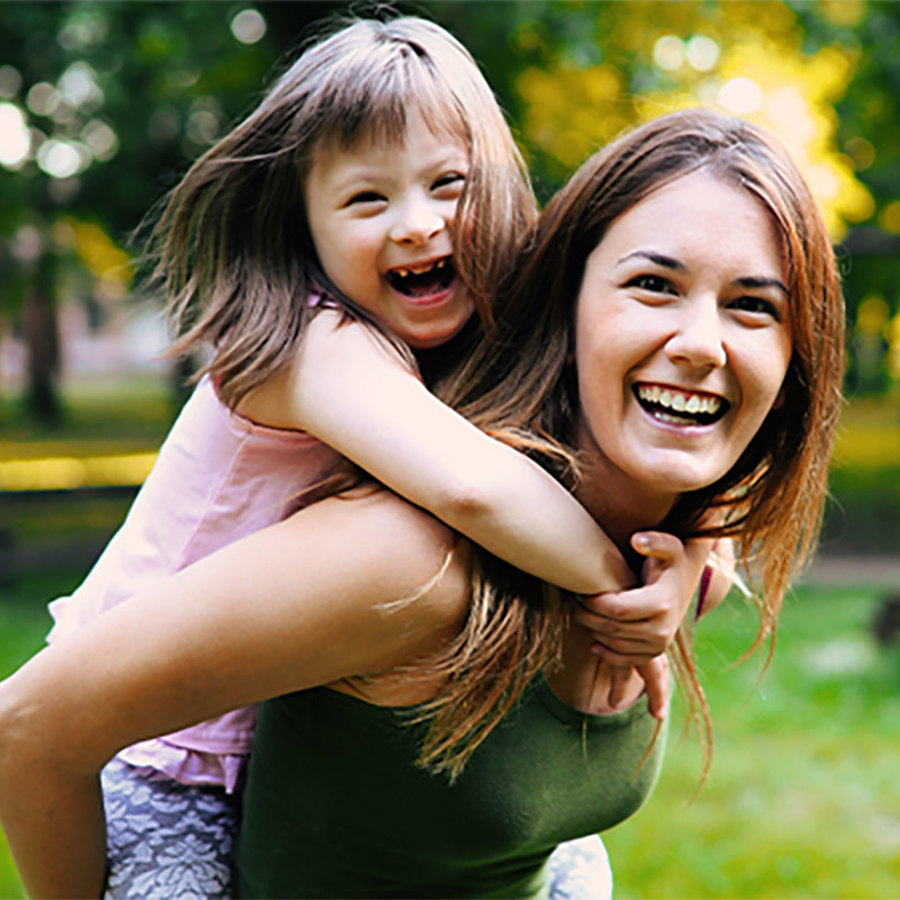 Mother and child with special needs at the park.