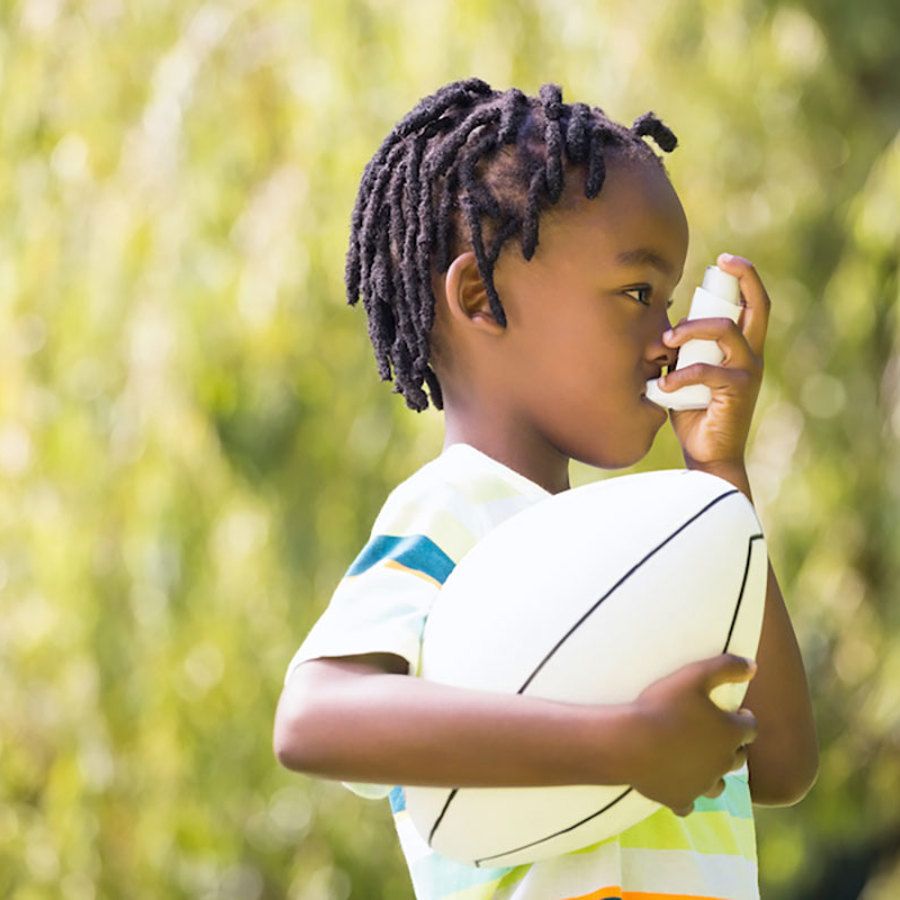 Boy with inhaler.