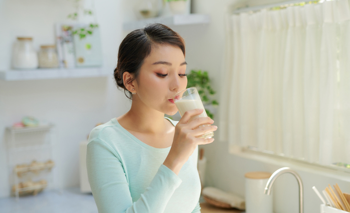 Woman drinking milk.
