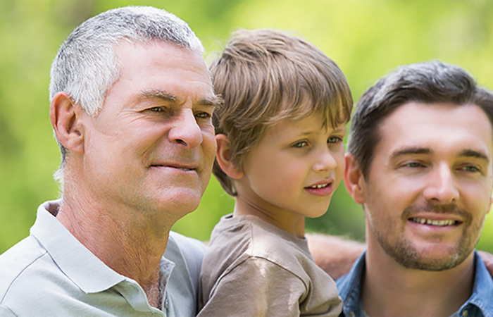 Grandfather, father, and son spending time together.