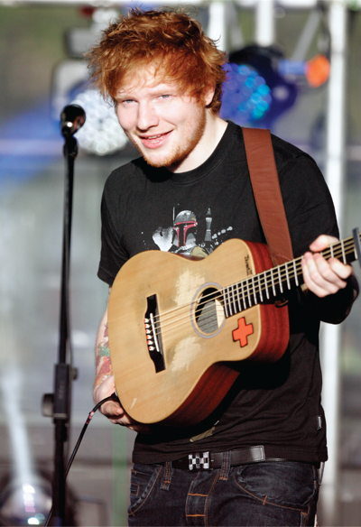 Ed Sheeran playing the guitar.