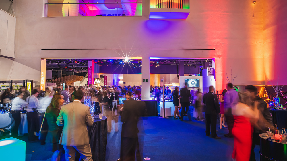 A corporate event with guests enjoying the Lower Level exhibits.